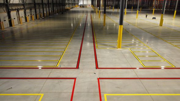 Lines painted on a commercial warehouse floor by EverLine Coatings and Services
