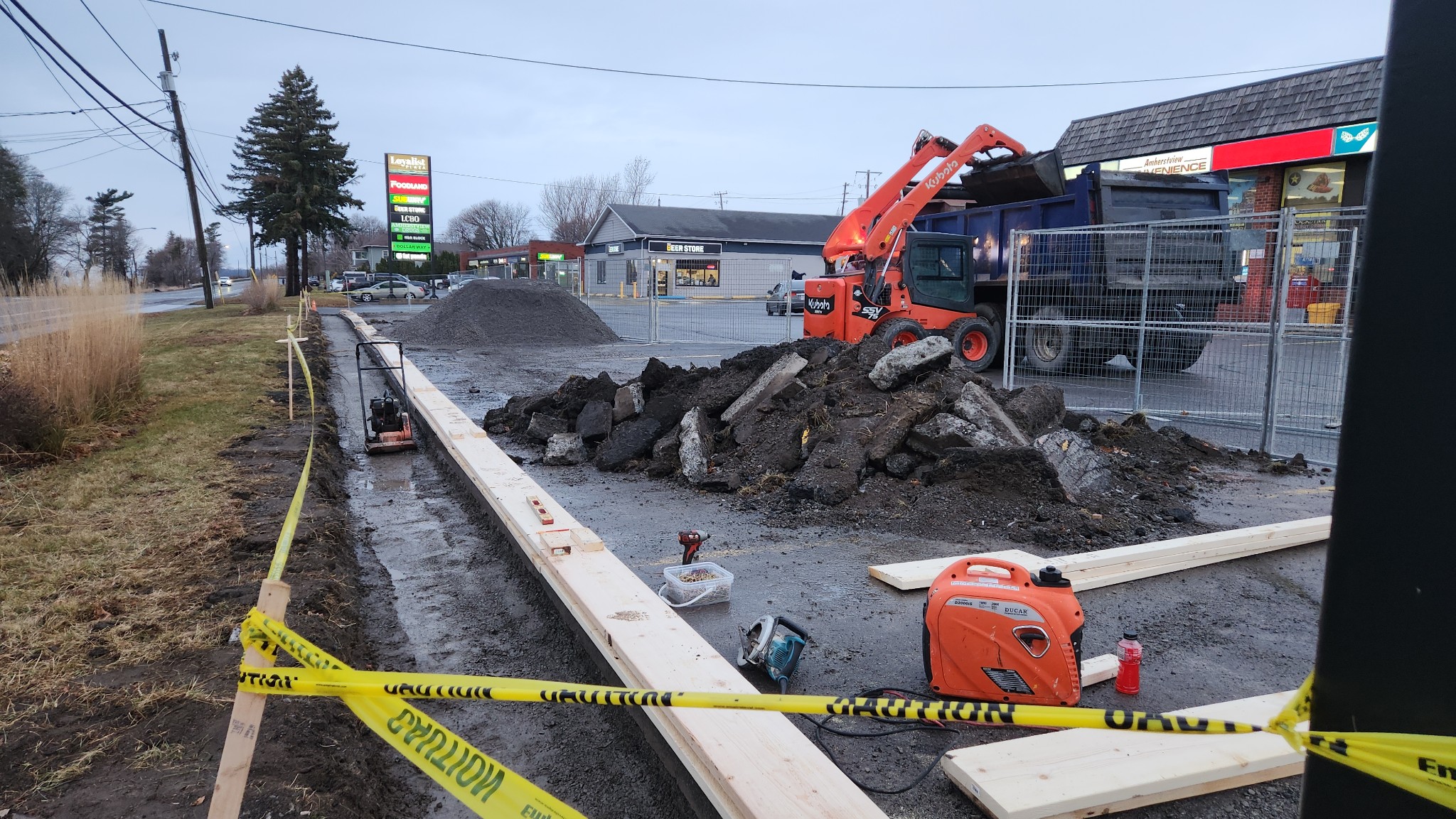 amherstview strip mall curb installation and asphalt paving