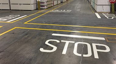 Lines painted on a warehouse floor by EverLine Coatings
